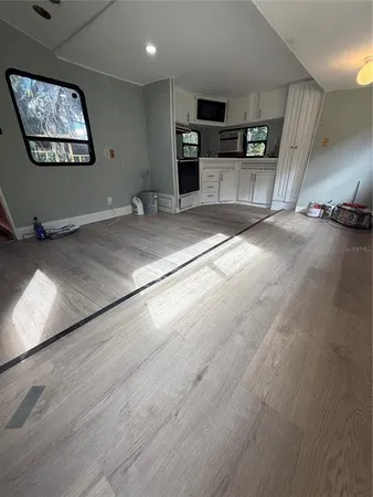 a view of a livingroom with furniture and a flat screen tv