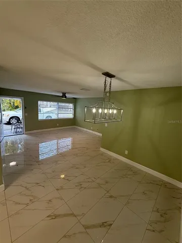 a view of a kitchen and an entryway