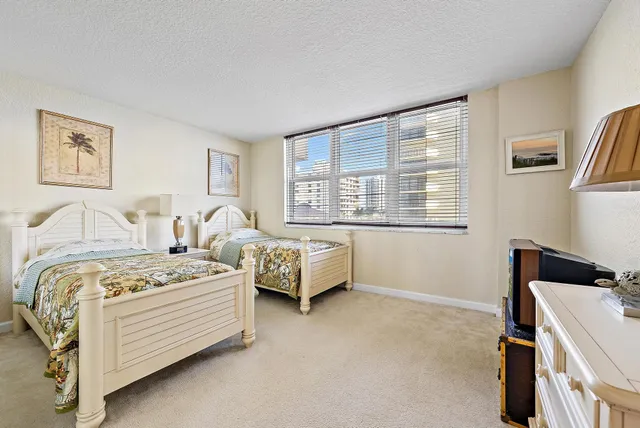 a bedroom with bed and window