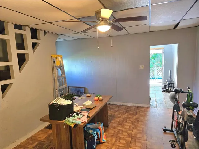 a workspace with furniture and wooden floor