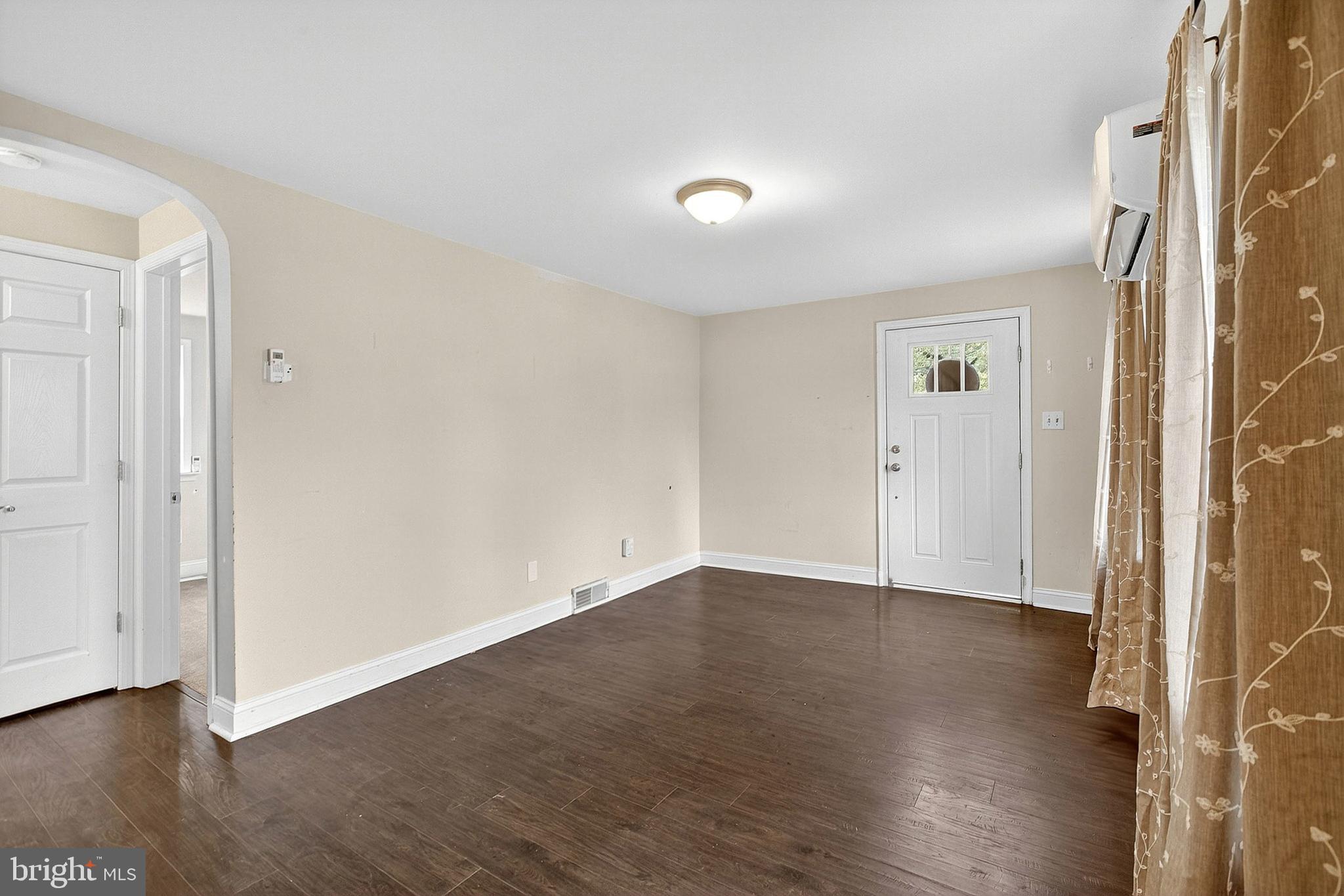 138 Diamond Street Hatfield, PA 19440 - Photo 8 of 33 an empty room with wooden floor and windows