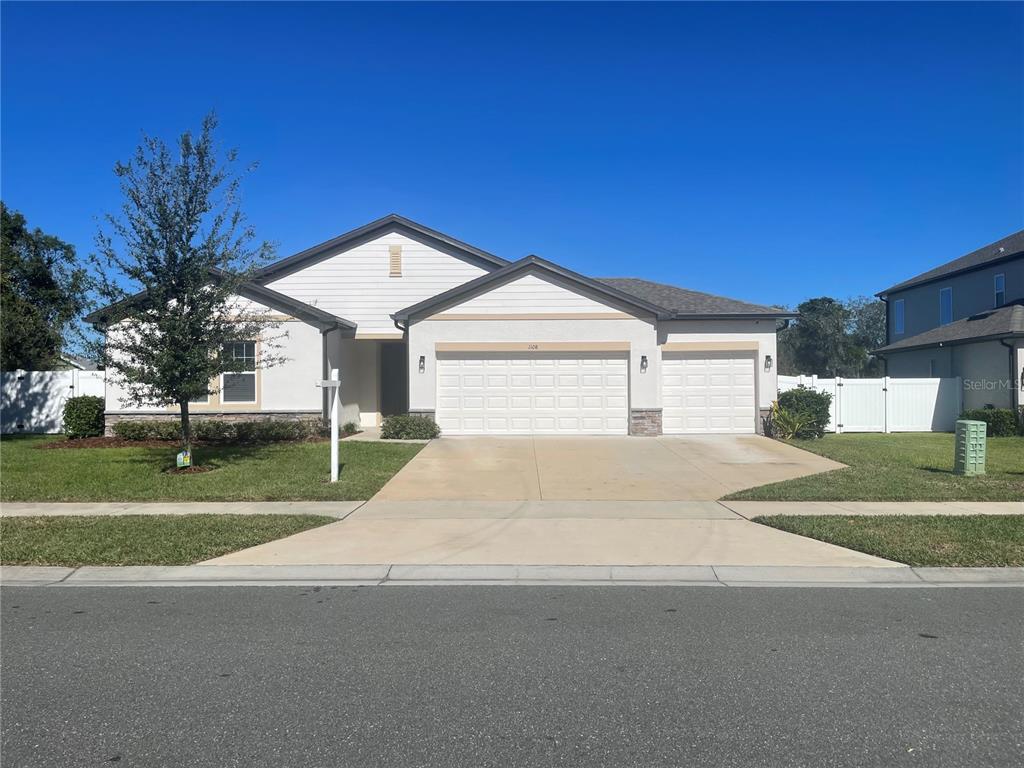 1108 Pearl Tree Road Deltona, FL 32725 - Photo 37 of 37 a front view of a house with a yard
