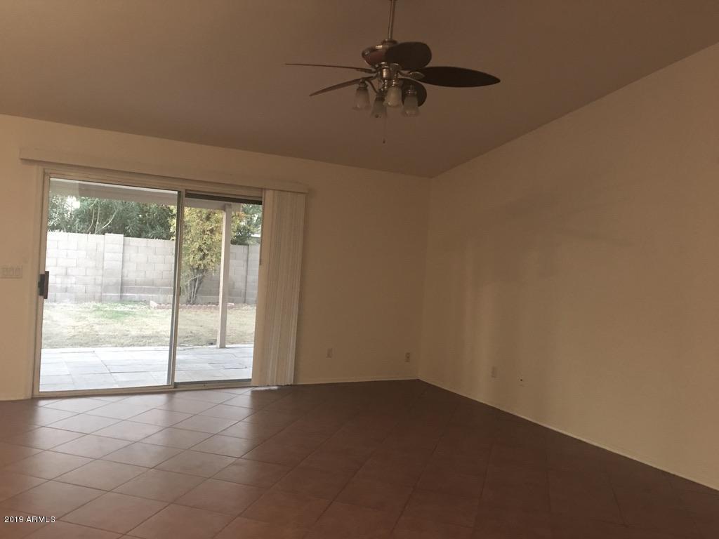 844 North Granite Street Gilbert, AZ 85234 - Photo 4 of 12 an empty room with a window