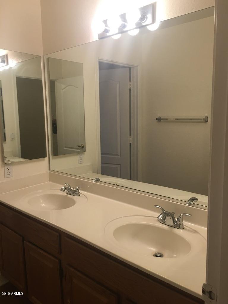 844 North Granite Street Gilbert, AZ 85234 - Photo 6 of 12 a bathroom with a sink and a mirror