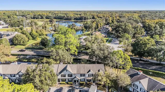 an aerial view of a house with a lake view