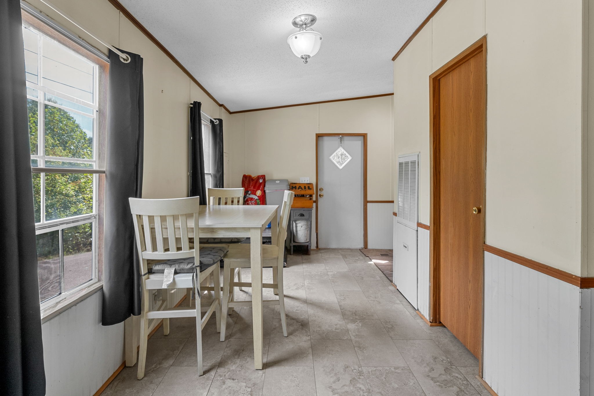 242 Barn Circle Road Big Rock, TN 37023 - Photo 11 of 40 a view of a dining room with furniture window and outside view