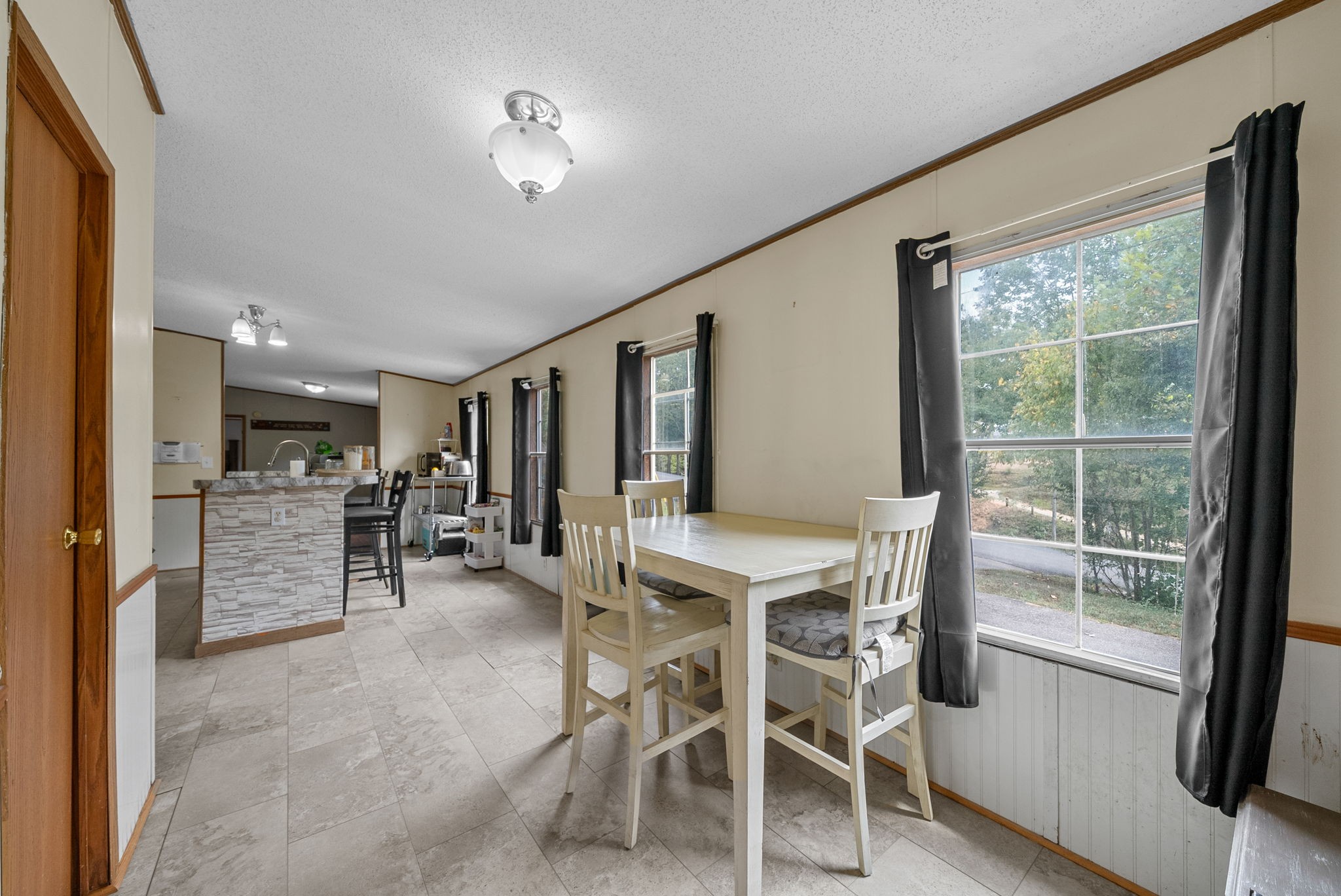242 Barn Circle Road Big Rock, TN 37023 - Photo 12 of 40 a view of a dining room with furniture window and outside view