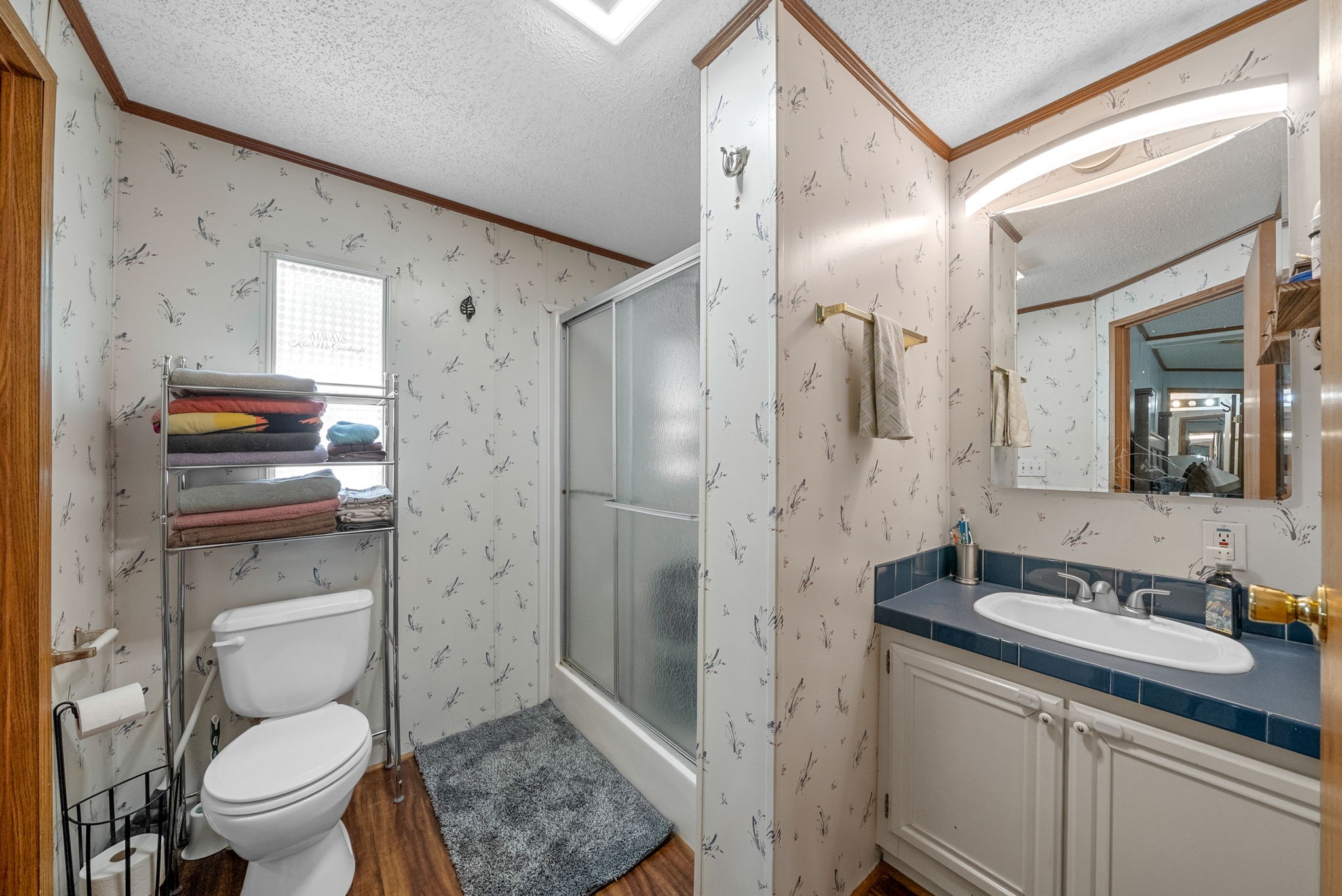 242 Barn Circle Road Big Rock, TN 37023 - Photo 17 of 40 a bathroom with a granite countertop sink toilet and shower