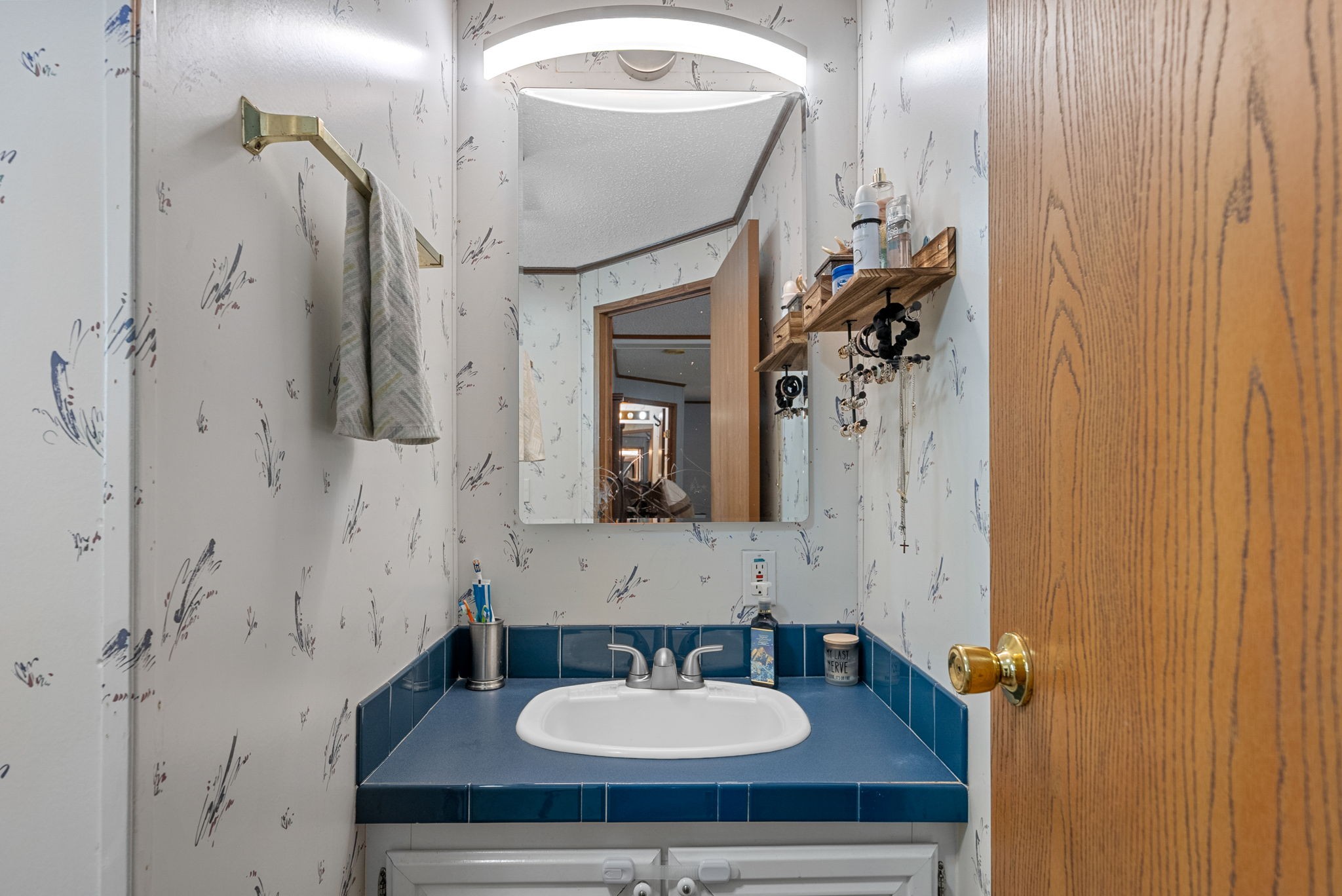 242 Barn Circle Road Big Rock, TN 37023 - Photo 18 of 40 a bathroom with a sink and a mirror