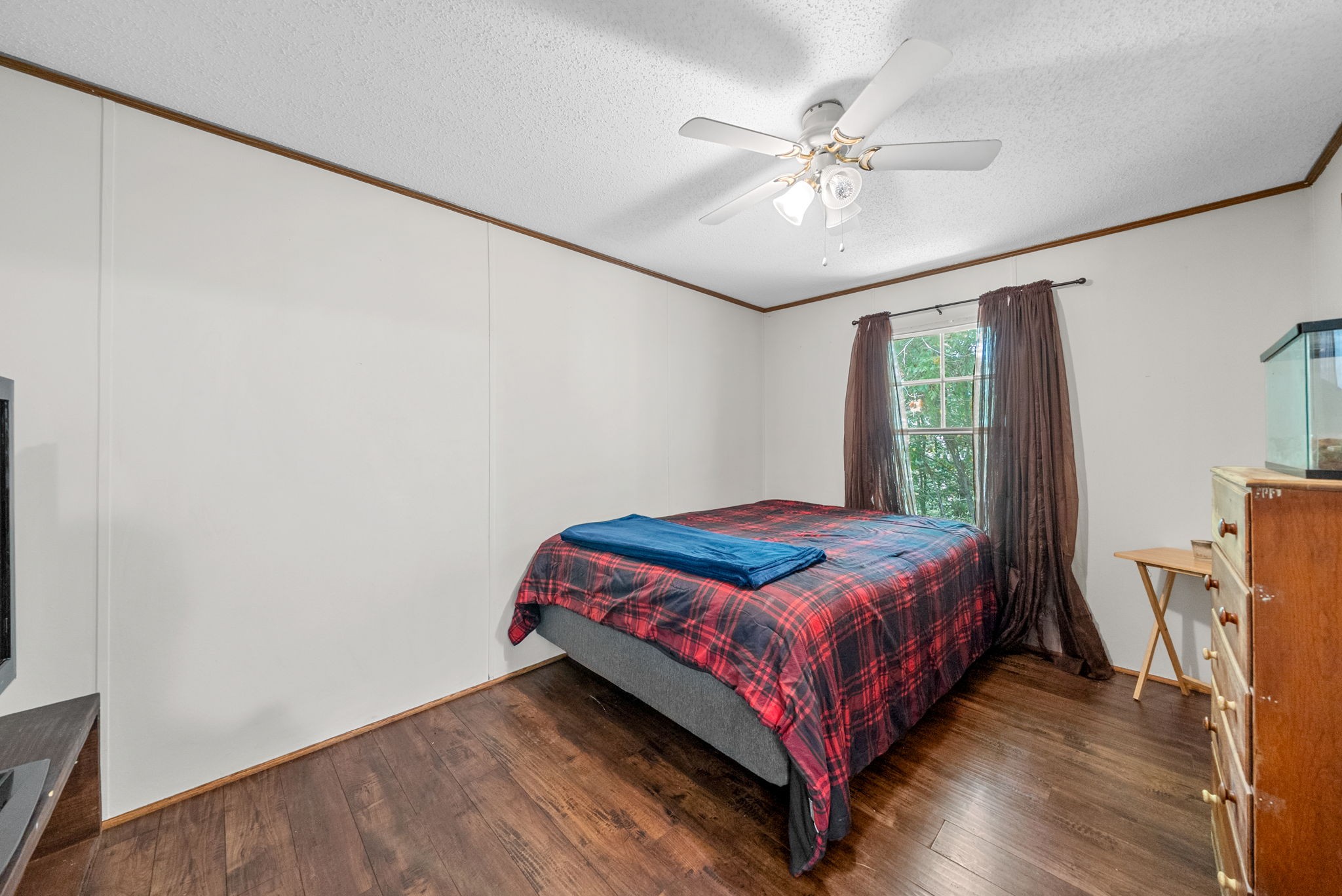 242 Barn Circle Road Big Rock, TN 37023 - Photo 24 of 40 a bed sitting in a bedroom next to a window