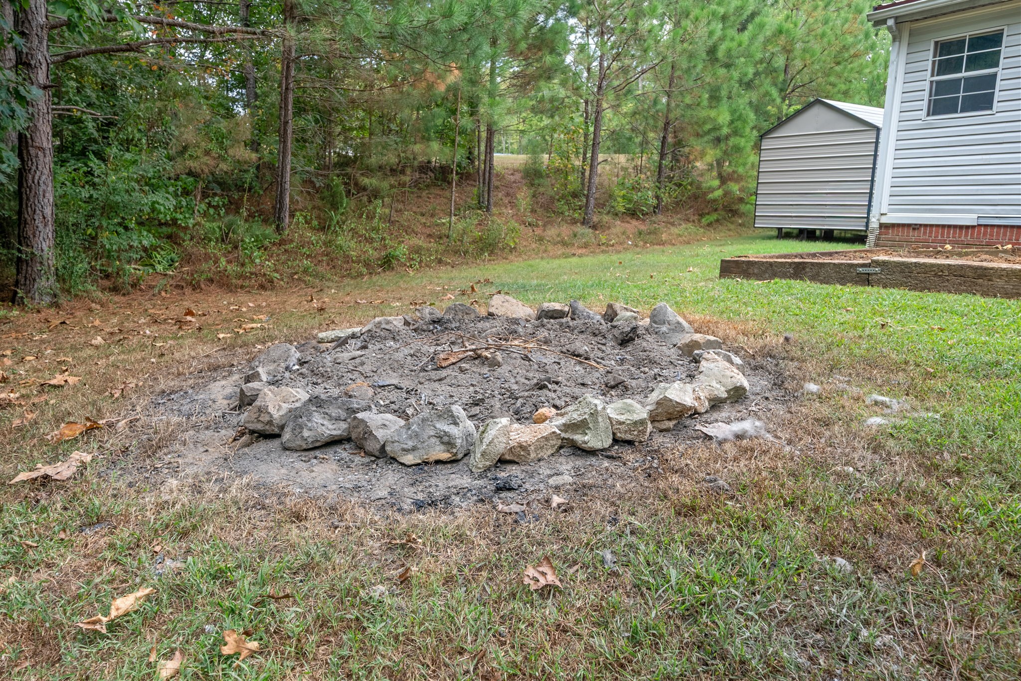 242 Barn Circle Road Big Rock, TN 37023 - Photo 31 of 40 a view of a backyard with large trees