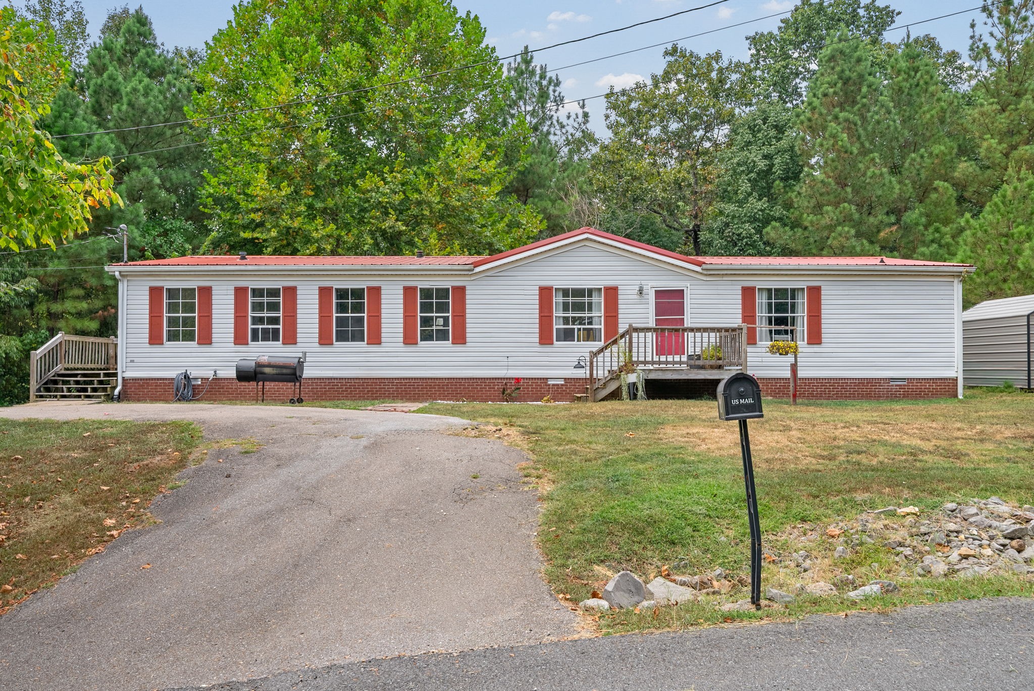 242 Barn Circle Road Big Rock, TN 37023 - Photo 34 of 40 a view of a house with a yard and large tree