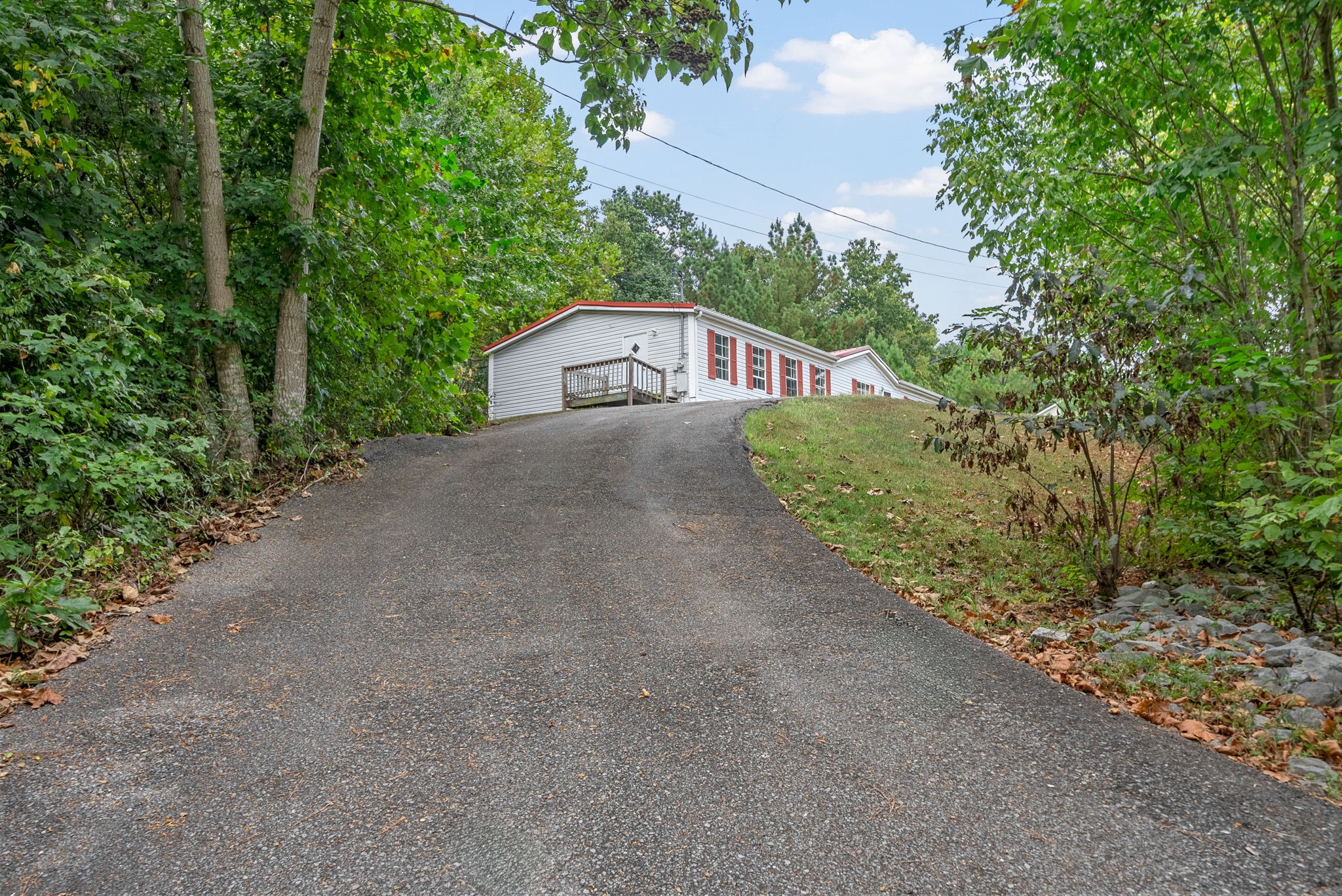242 Barn Circle Road Big Rock, TN 37023 - Photo 35 of 40 a view of a house with a yard and large trees