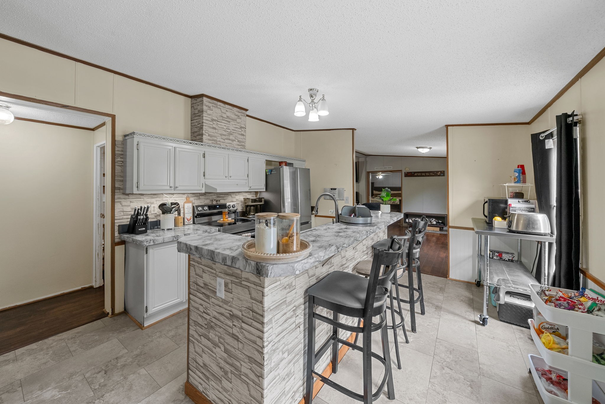 242 Barn Circle Road Big Rock, TN 37023 - Photo 9 of 40 a kitchen with kitchen island a appliances dining table and chairs