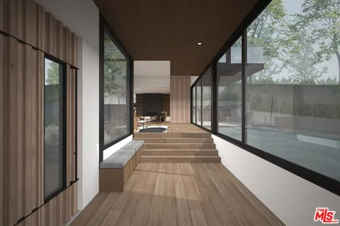 a view of a dining room with furniture and a large window