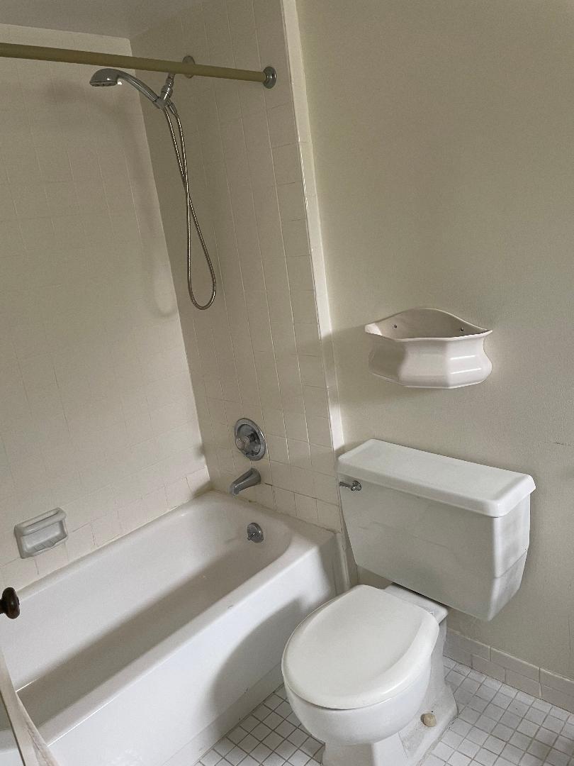 5500 Old Ocean Boulevard, Unit 104 Ocean Ridge, FL 33435 - Photo 11 of 19 a white toilet sitting next to a bath tub