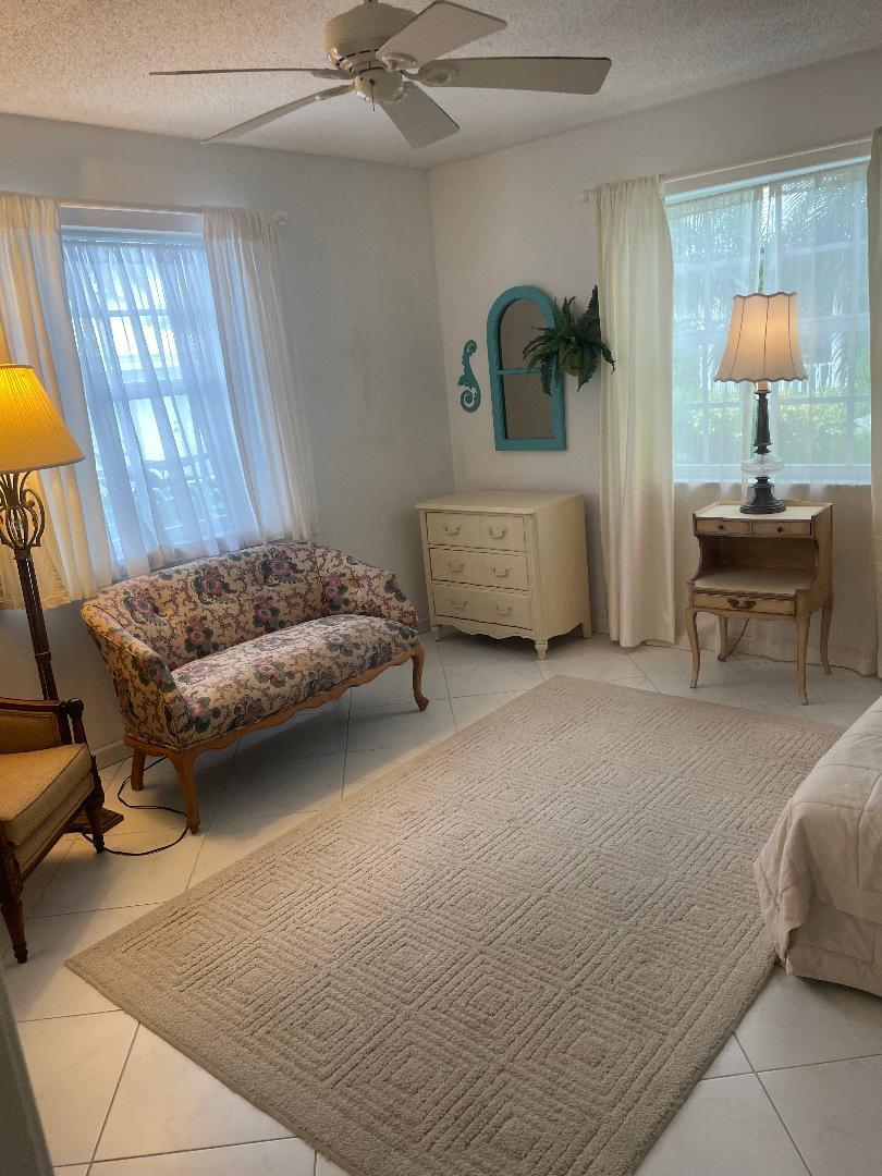 5500 Old Ocean Boulevard, Unit 104 Ocean Ridge, FL 33435 - Photo 12 of 19 a bedroom with a bed and window