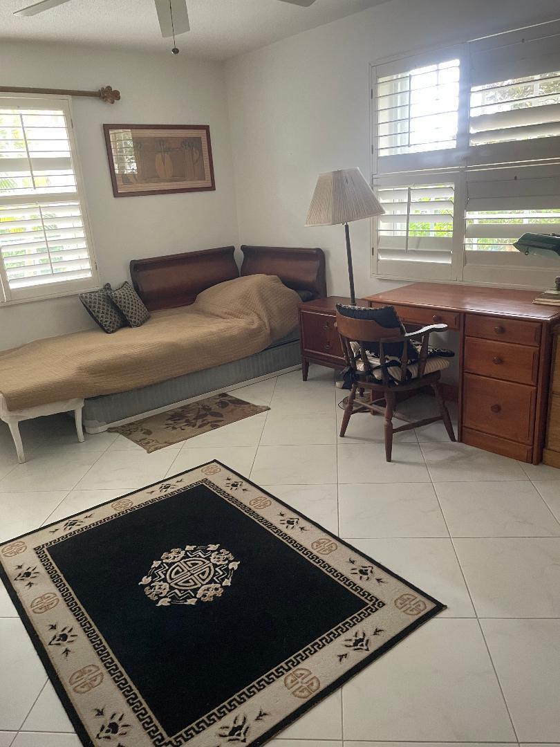 5500 Old Ocean Boulevard, Unit 104 Ocean Ridge, FL 33435 - Photo 9 of 19 a living room with furniture and a window