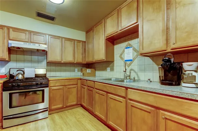 a reading room with furniture book shelf and a book shelf