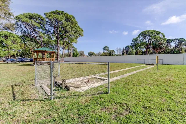 a view of a playground with a tree