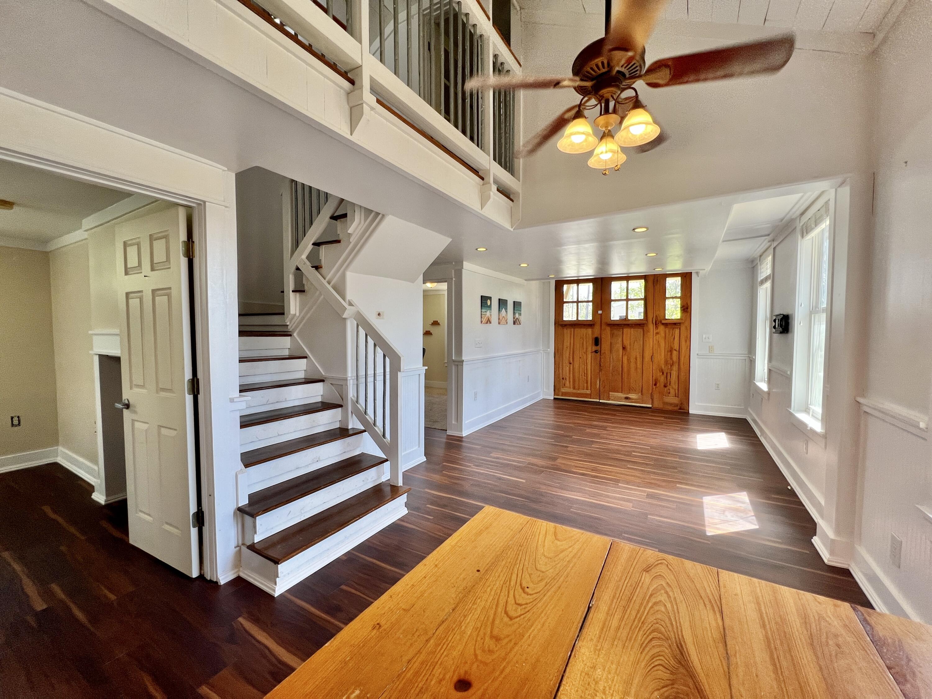 108 7th Street Santa Rosa Beach, FL 32459 - Photo 11 of 25 New Flooring Dining/Living and Stairs