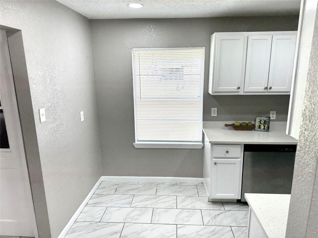 903 Roper Street Houston, TX 77034 - Photo 11 of 18 a kitchen with a cabinets and window