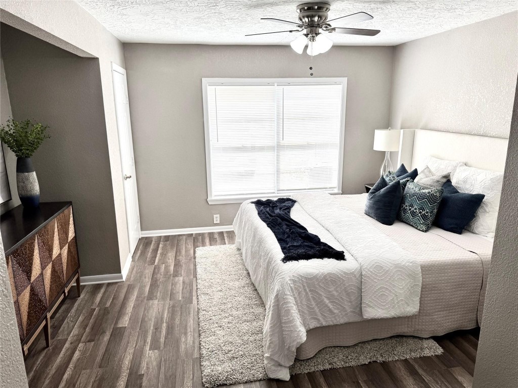 903 Roper Street Houston, TX 77034 - Photo 12 of 18 a bedroom with a bed and a chandelier