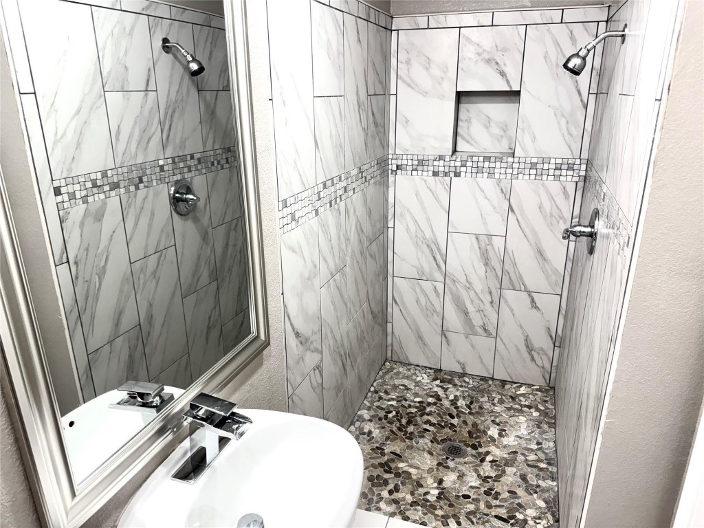 903 Roper Street Houston, TX 77034 - Photo 13 of 18 a bathroom with a sink and a shower curtain