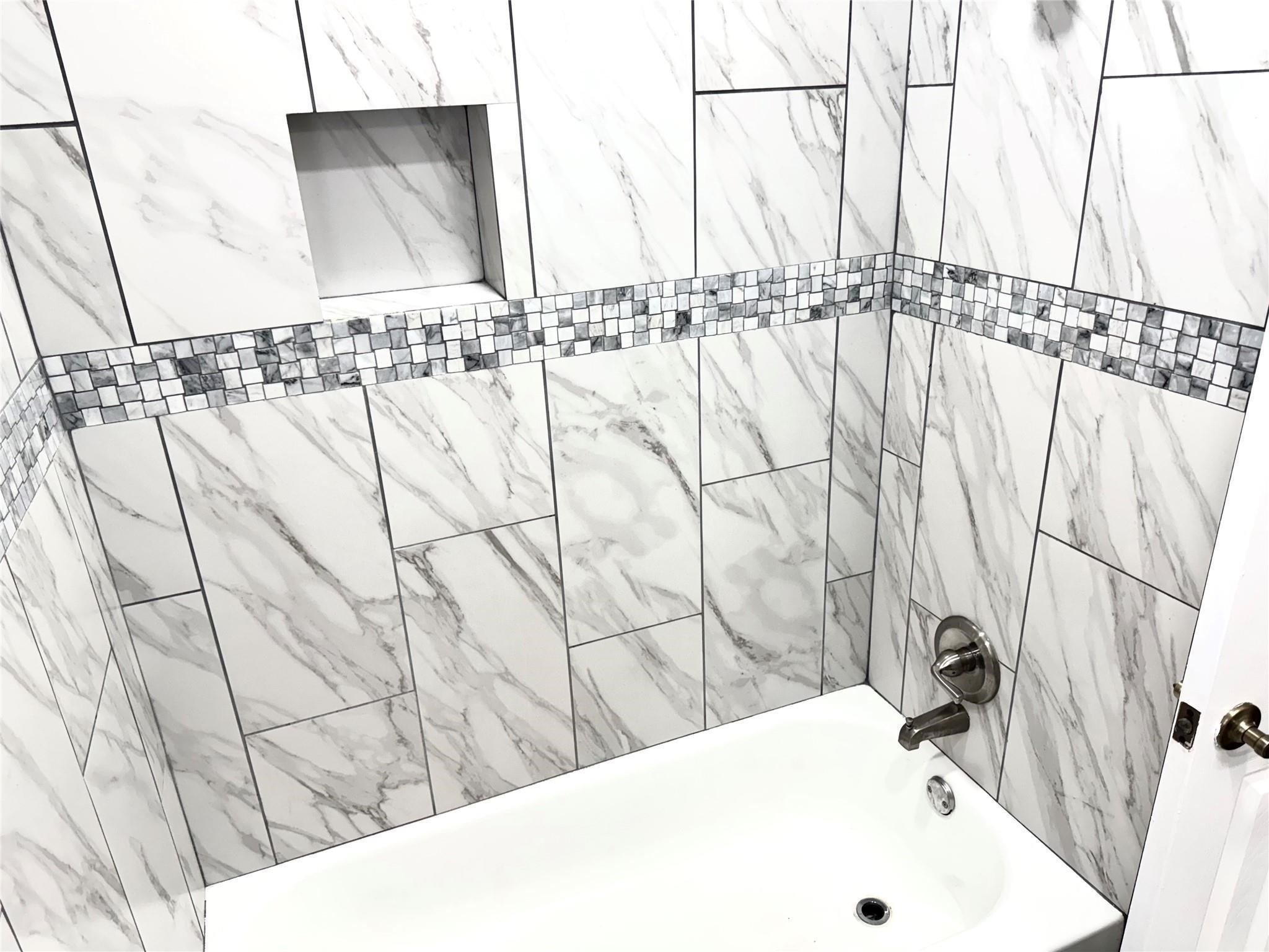 903 Roper Street Houston, TX 77034 - Photo 18 of 18 a bathroom with a bathtub and shower