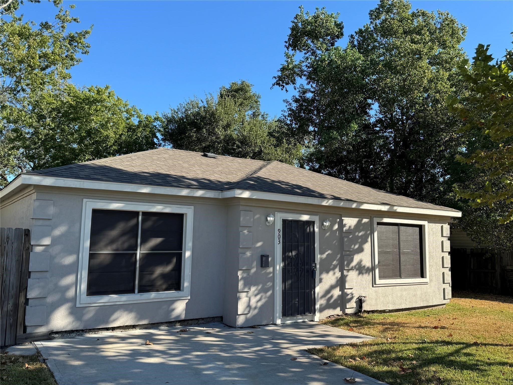 903 Roper Street Houston, TX 77034 - Photo 2 of 18 a front view of a house with a yard