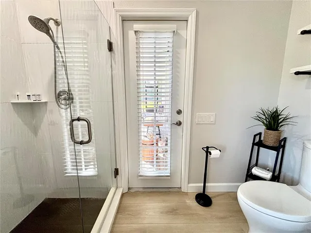 a view of a room with windows and glass door