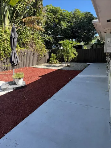 a view of a yard with an outdoor space