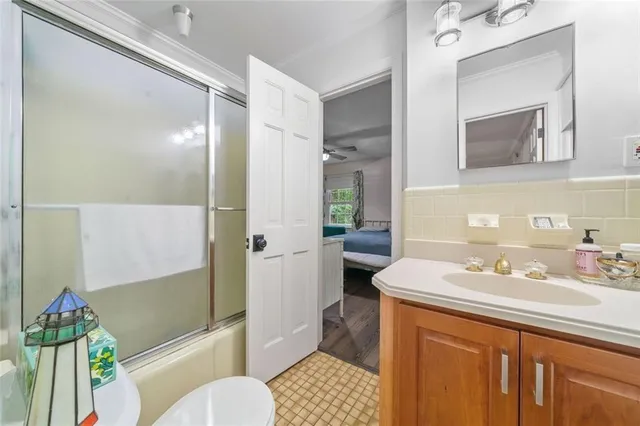 a projector room with furniture and a flat screen tv