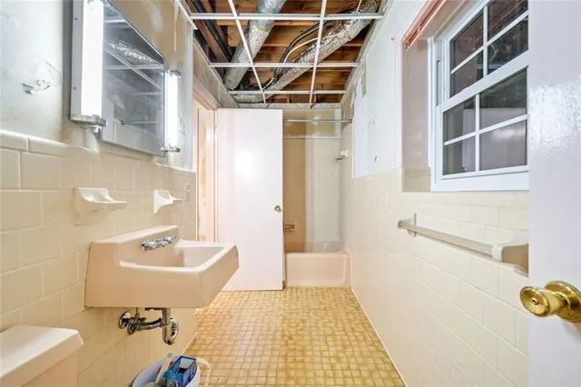 a view of a chairs and table in the backyard