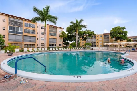 a view of swimming pool having outdoor seating