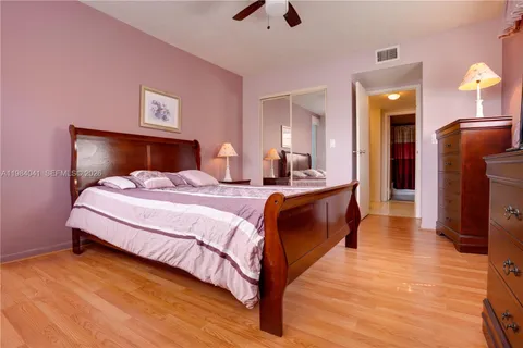 a bed room with a bed and a chandelier