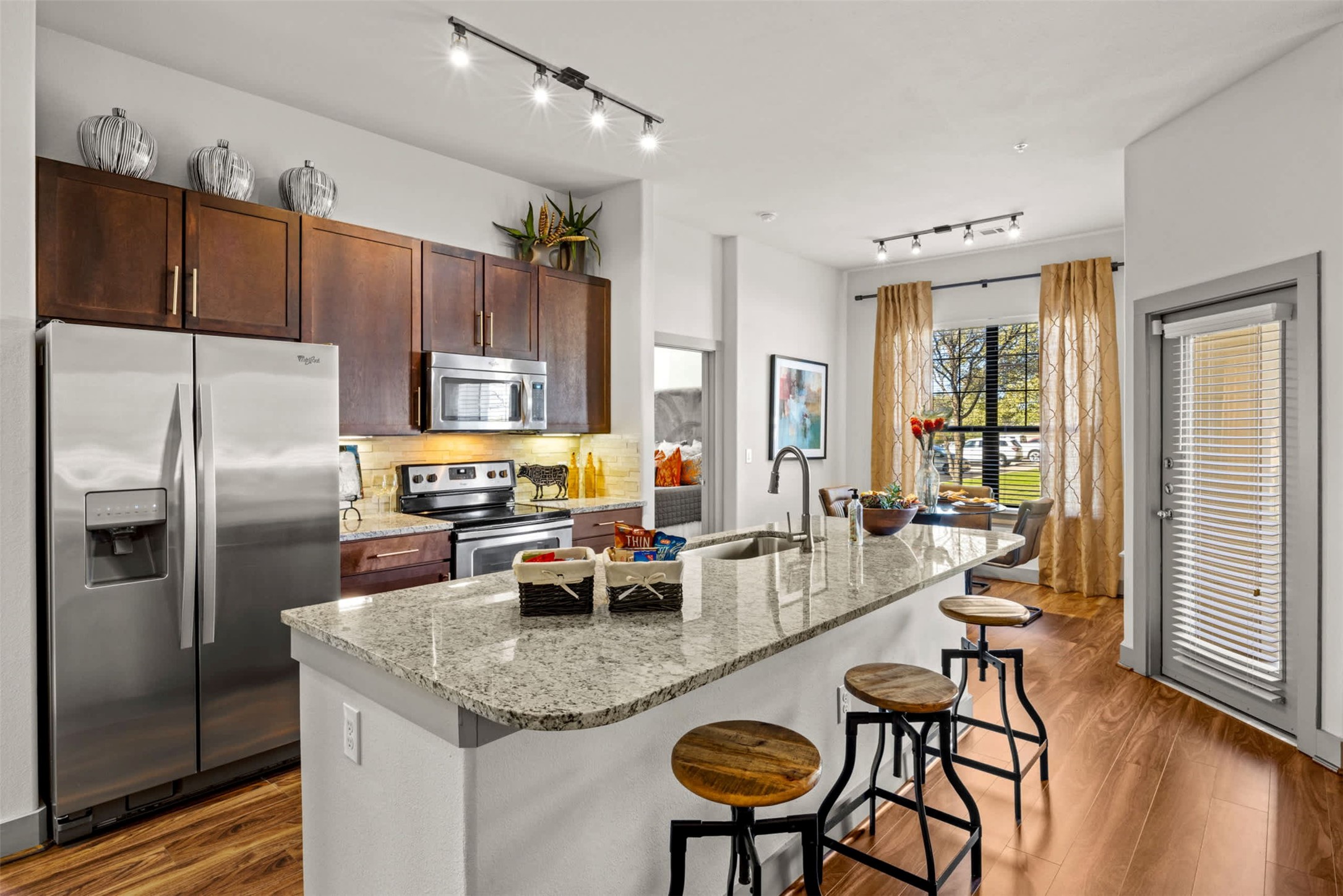 8100 Anderson Mill Road, Unit 2301 Austin, TX 78729 - Photo 6 of 19 a kitchen with sink refrigerator and dining table