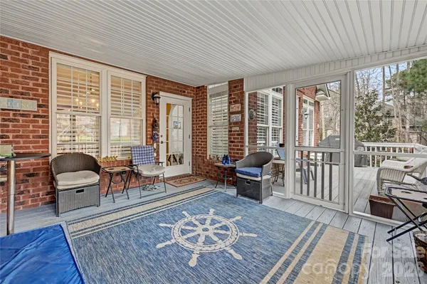 a living room with furniture and a rug