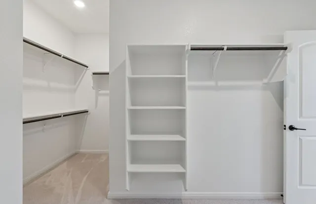 an empty room with a bathroom