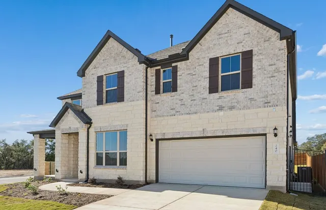 a front view of a house with garage