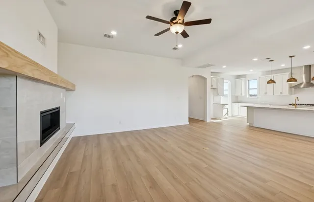 a view of a kitchen with a sink and a stove