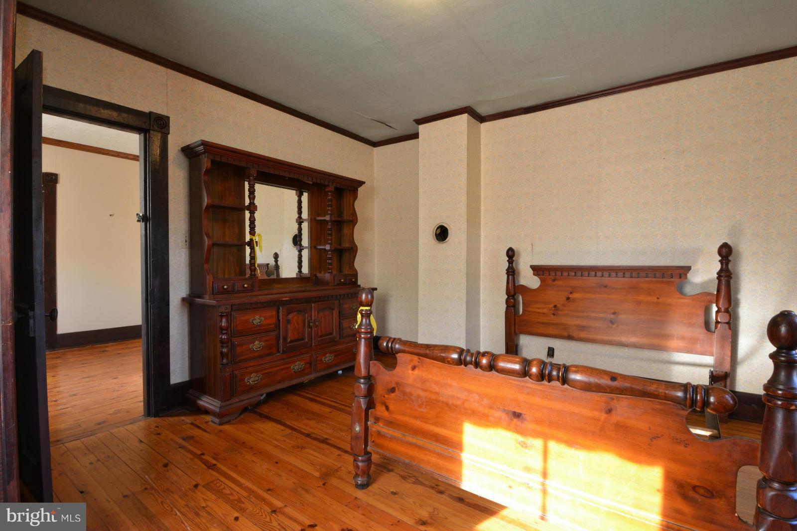 4479 Courtneys Corner Road Sumerduck, VA 22742 - Photo 18 of 30 a bedroom with a bed and a dresser