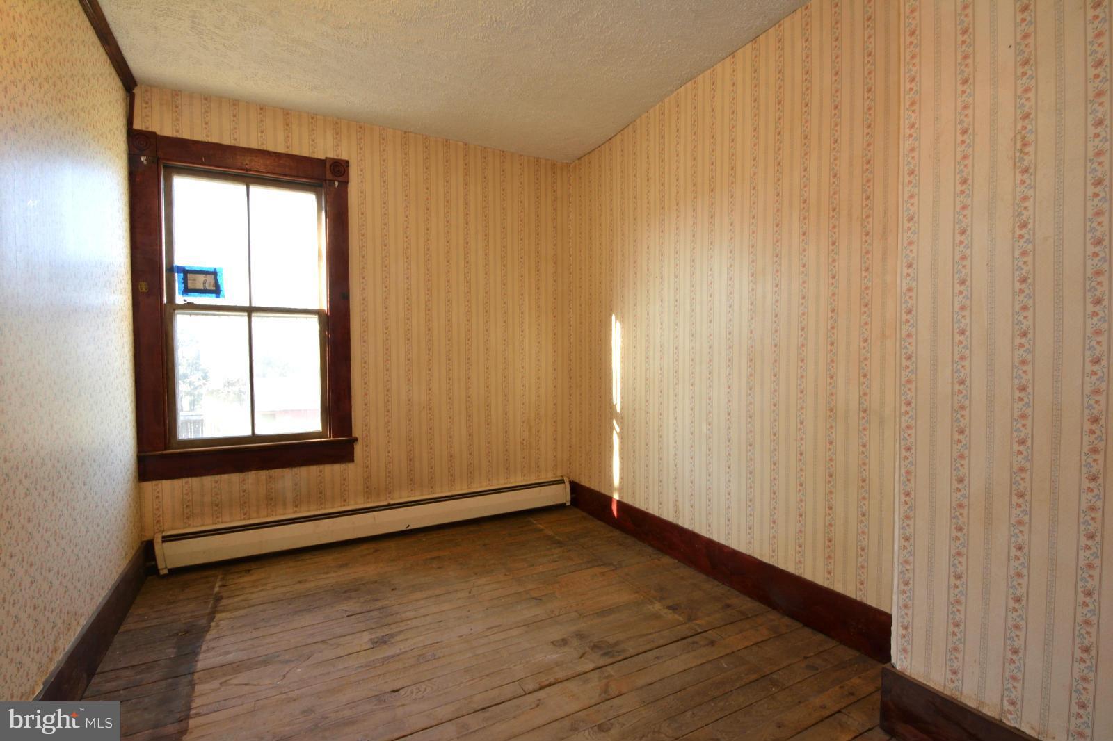 4479 Courtneys Corner Road Sumerduck, VA 22742 - Photo 20 of 30 an empty room with wooden floor and windows