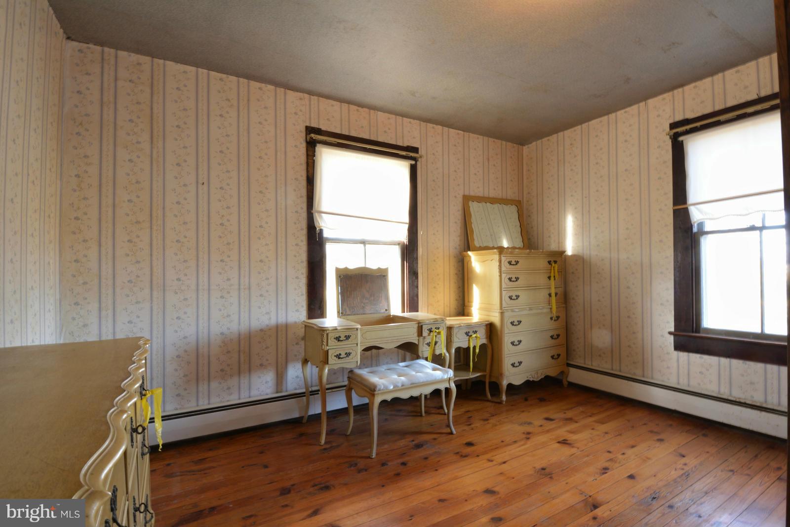 4479 Courtneys Corner Road Sumerduck, VA 22742 - Photo 23 of 30 an empty room with wooden floor and a window