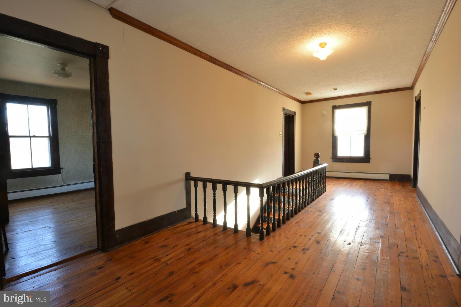 4479 Courtneys Corner Road Sumerduck, VA 22742 - Photo 24 of 30 a view of hallway with wooden floor