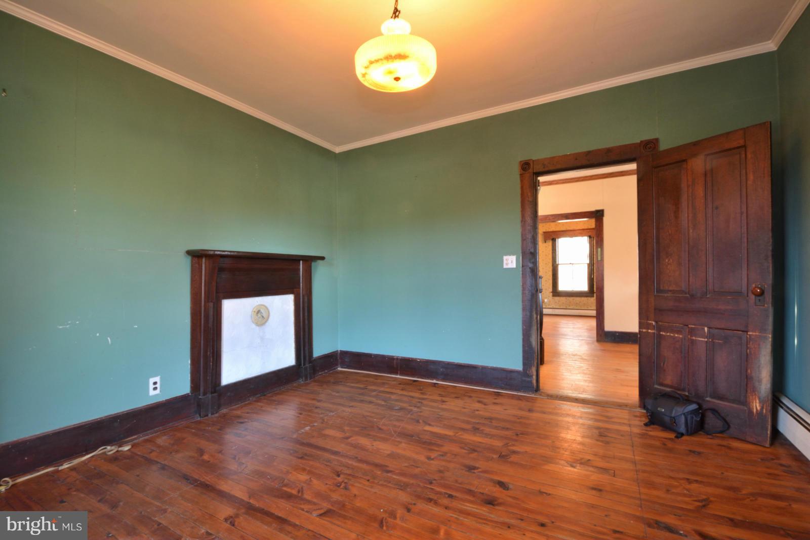 4479 Courtneys Corner Road Sumerduck, VA 22742 - Photo 10 of 30 an empty room with wooden floor and windows