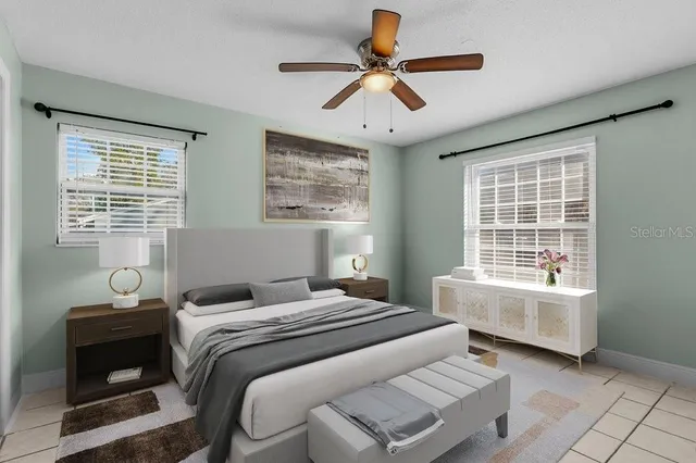 a bedroom with a bed and a window