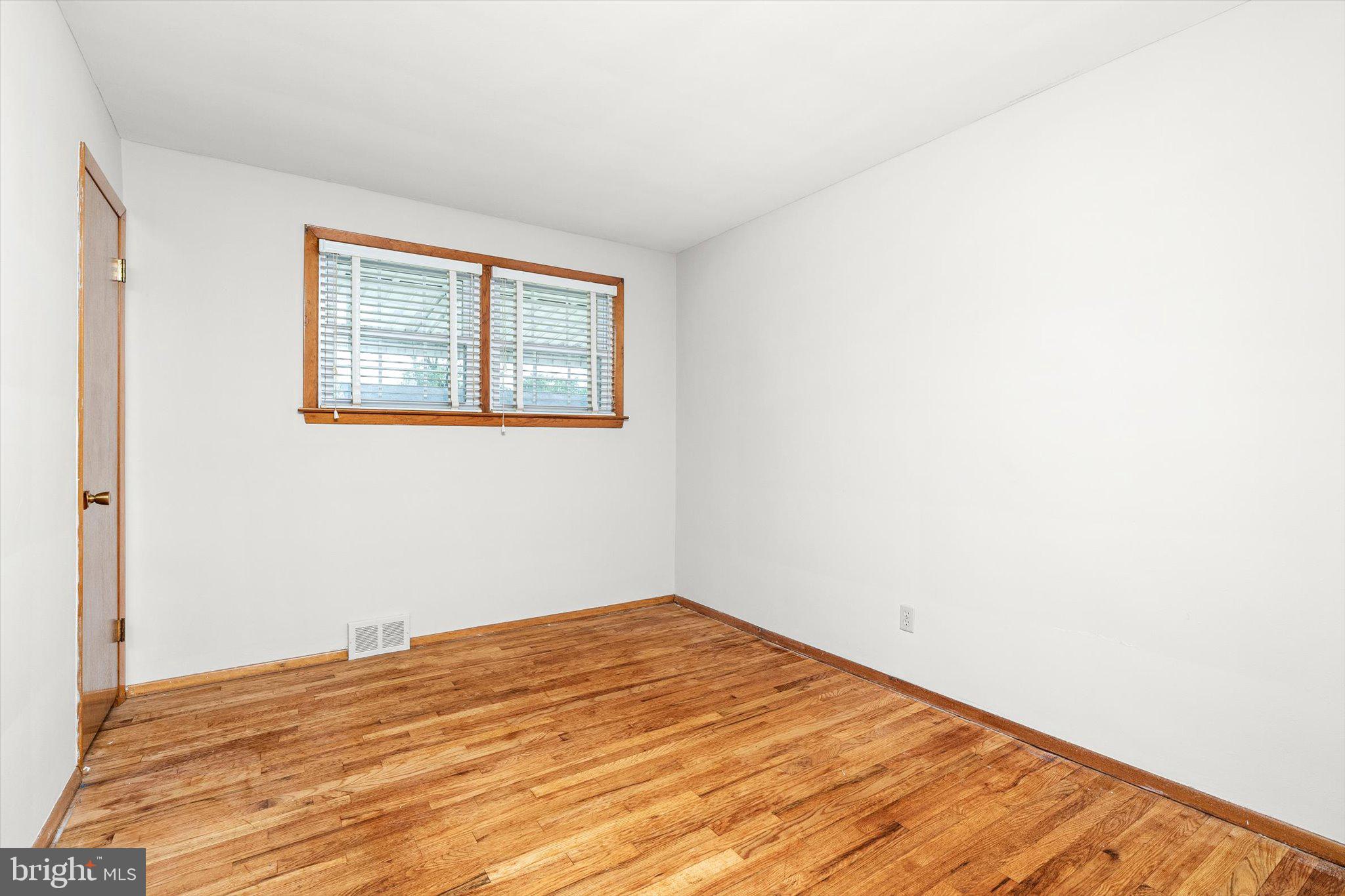 10 Whitman Road Hamilton, NJ 08619 - Photo 14 of 28 a view of empty room with wooden floor