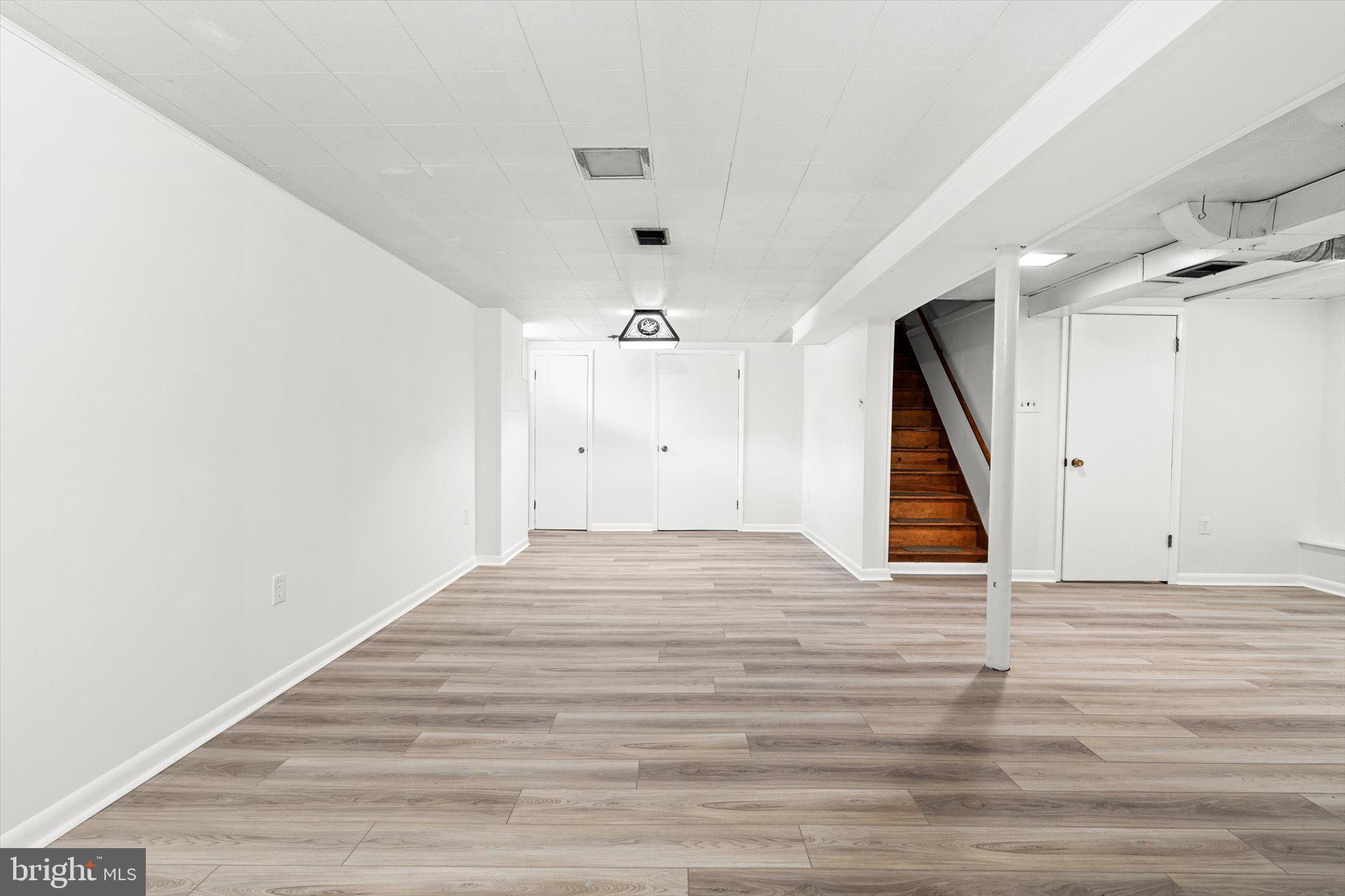 10 Whitman Road Hamilton, NJ 08619 - Photo 20 of 28 a view of an empty room with wooden floor