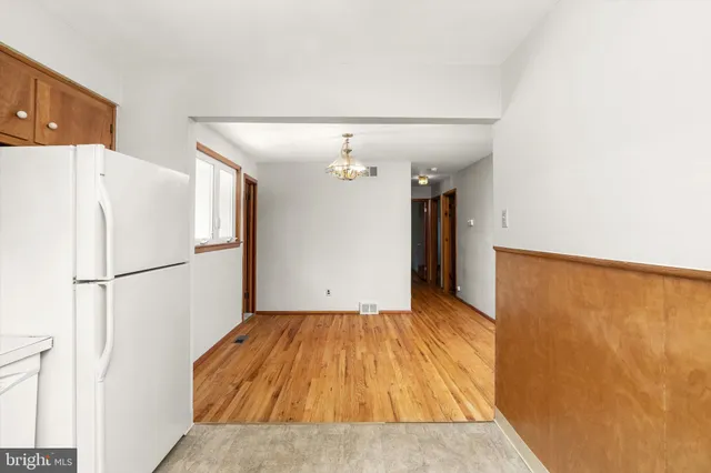 a view of a kitchen with a refrigerator a sink and a refrigerator